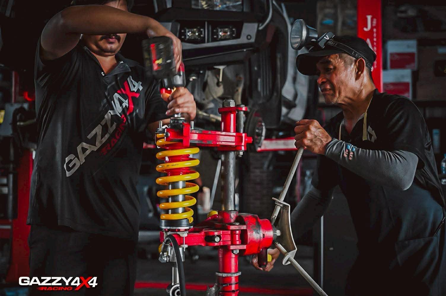 Custom coilover suspension being installed